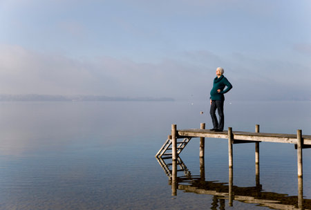 pregnant woman standing on pierの写真素材
