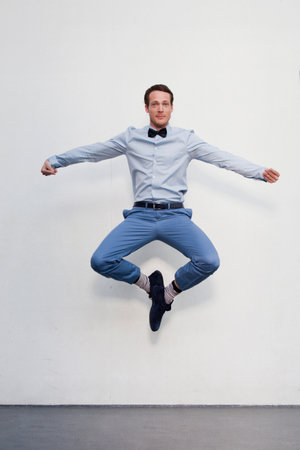 man jumping in the airの写真素材