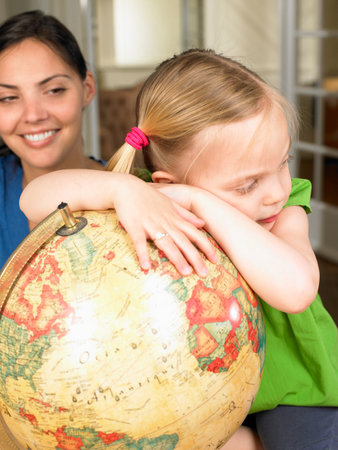 Mother and daughter exploring the worldの写真素材