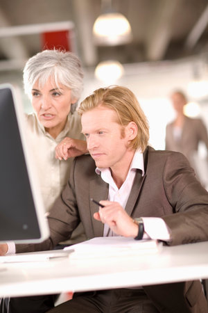 woman and man working in an officeの写真素材