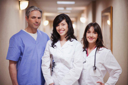 Female Doctors and male surgeon smiling