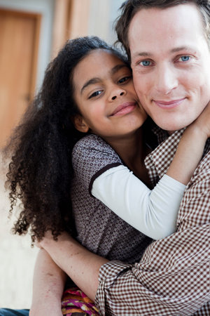 young girl and man embracingの写真素材