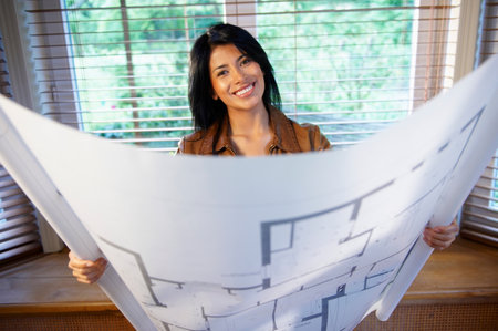 Woman holding a blue printの写真素材