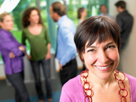 Business woman in the office, smilingの写真素材