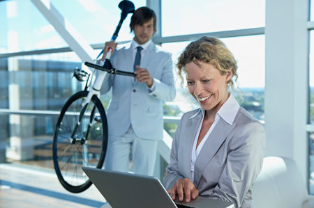 business man and woman with computerの写真素材