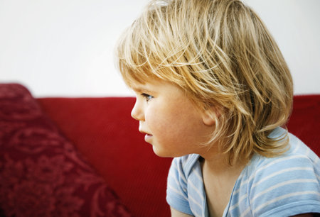 A profile head shot of a young boy
