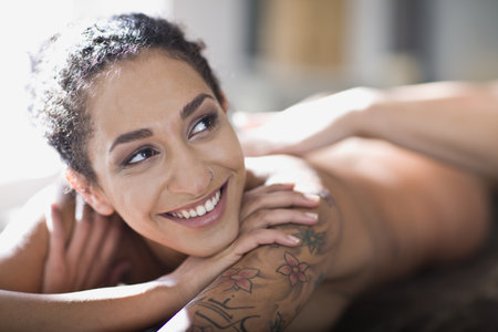 woman lies on a massage bedの写真素材