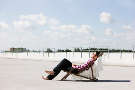 man relaxing in the sunの写真素材