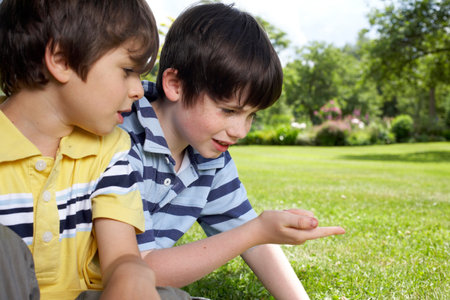 Kids playing in gardenの写真素材
