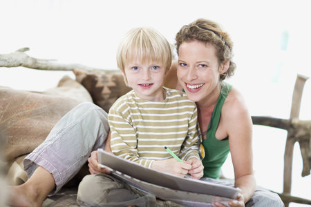 mother and son are paintingの写真素材