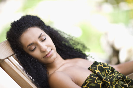 woman lies on a loungerの写真素材