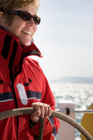 Woman sailing yacht