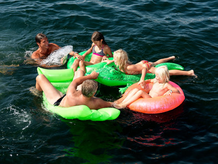 Family playing in waterの写真素材