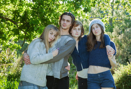 Young adults with arms around each otherの写真素材