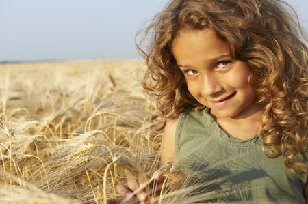 Girl in a wheat fieldの写真素材