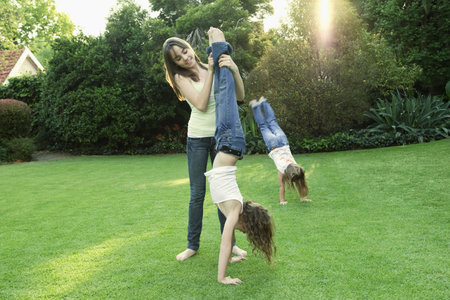 Girls playing in gardenの写真素材