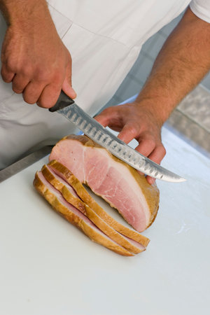 Butcher slicing meatの写真素材