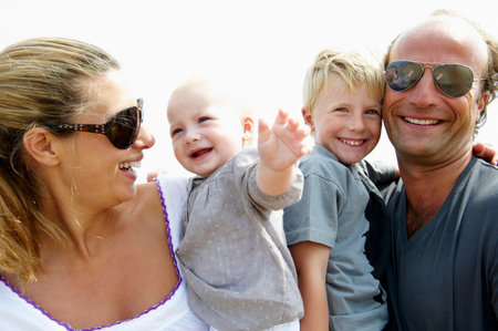 Happy family smiling at camera