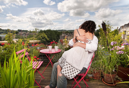 couple sitting on balconyの写真素材
