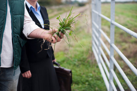 farmer showing business woman cropの写真素材