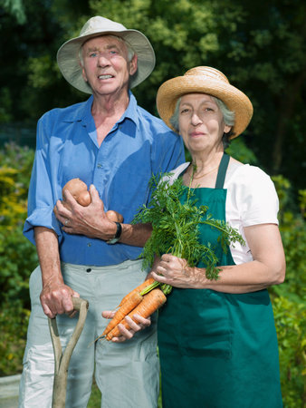Senior couple with vegetablesの写真素材