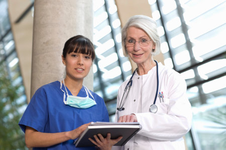 Scrub nurse and woman doctorの写真素材