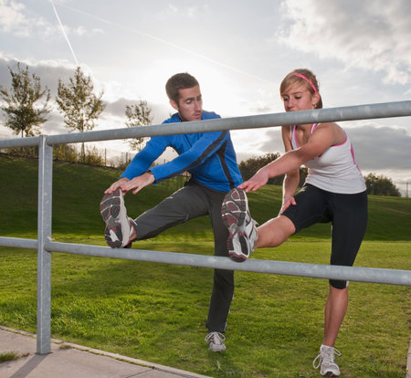 athletes stretching togetherの写真素材