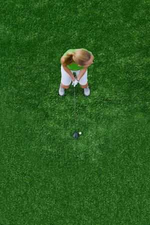 Woman playing golfの写真素材