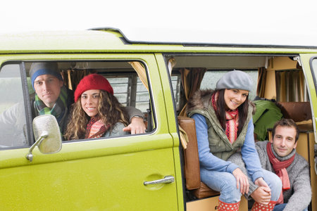 Couples looking out of camper vanの写真素材