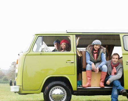 Couples looking out of camper vanの写真素材