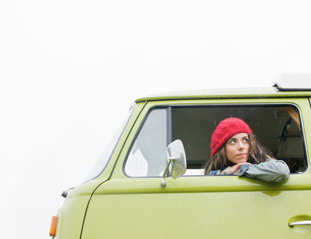 Woman looking out of camper van