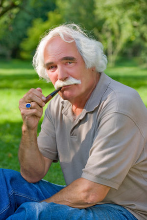 Grandfather smoking his pipeの写真素材