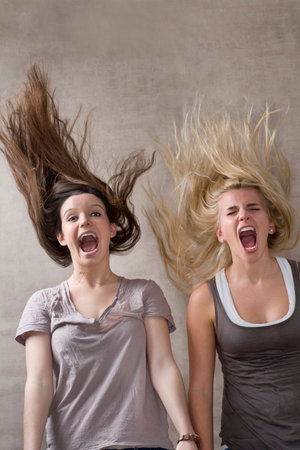 Teen girls laughing togetherの写真素材