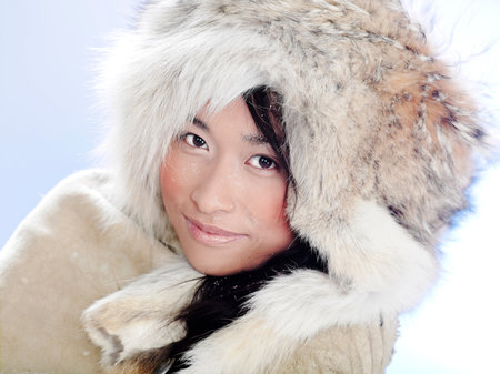 Portrait of a woman wearing a fur hatの写真素材