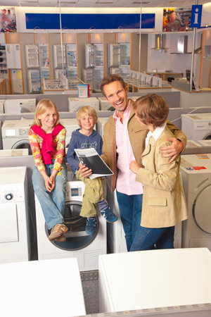 Family is happy about their new purchaseの写真素材