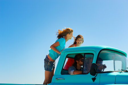 5 young people traveling in pickup truck
