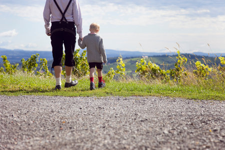 Man and boy wandering in the foothillsの写真素材