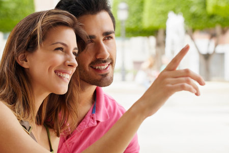 Attractive young couple in city squareの写真素材