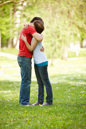 Young romantic couple in a parkの写真素材