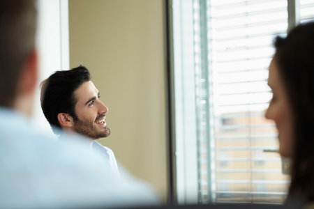 Smiling man in business meetingの写真素材