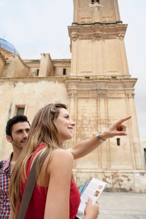 Tourist couple in old city squareの写真素材