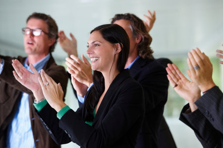 Business team applauding, smilingの写真素材