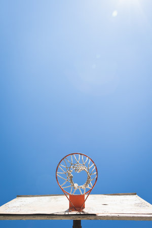 Basket ball hoop against blue skyの写真素材