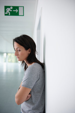 Woman dismissed from her workの写真素材