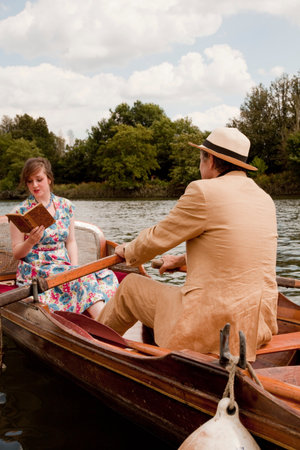 Father and daughter on a vintage boat