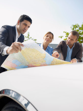 Businesspeople looking at map