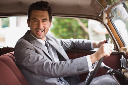 Bridegroom in carの写真素材