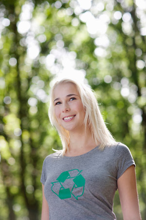 Young woman standing in natureの写真素材