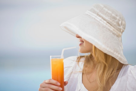 Girl having a drinkの写真素材