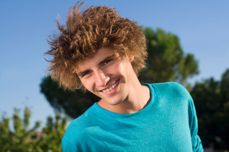 Young man portrait outsideの写真素材